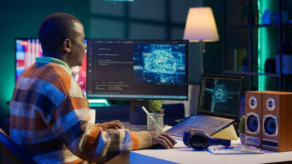 African american IT professional managing AI system for machine learning