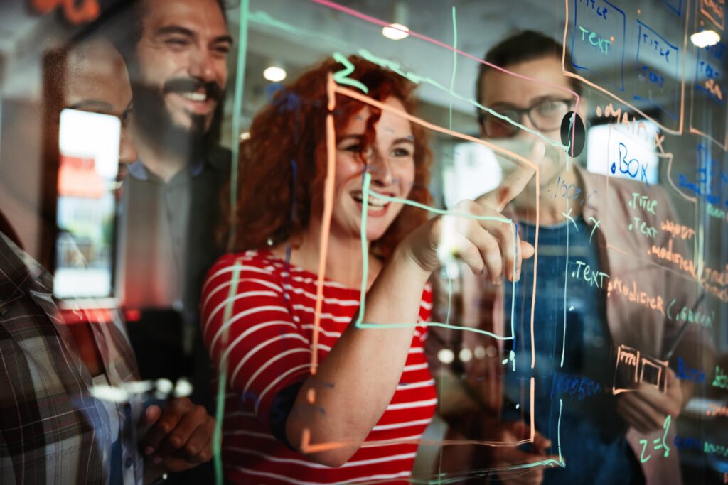 Happy software developers working on meeting, Programming advanced code artificial intelligence.