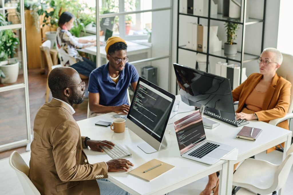 Programmers working in team at office